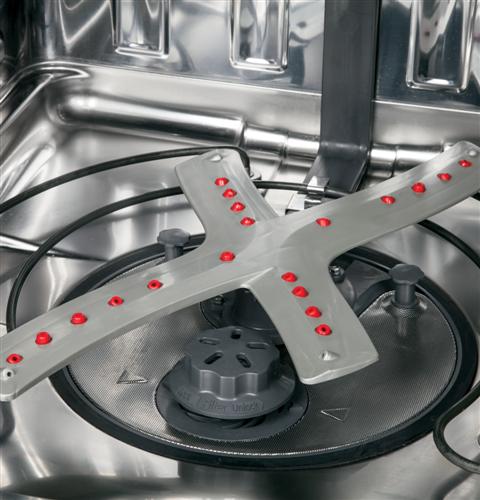 Reversing quad blade wash arm