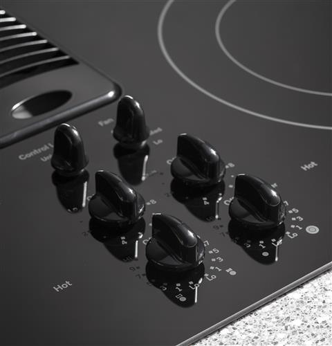 Knob controls with black glass surface