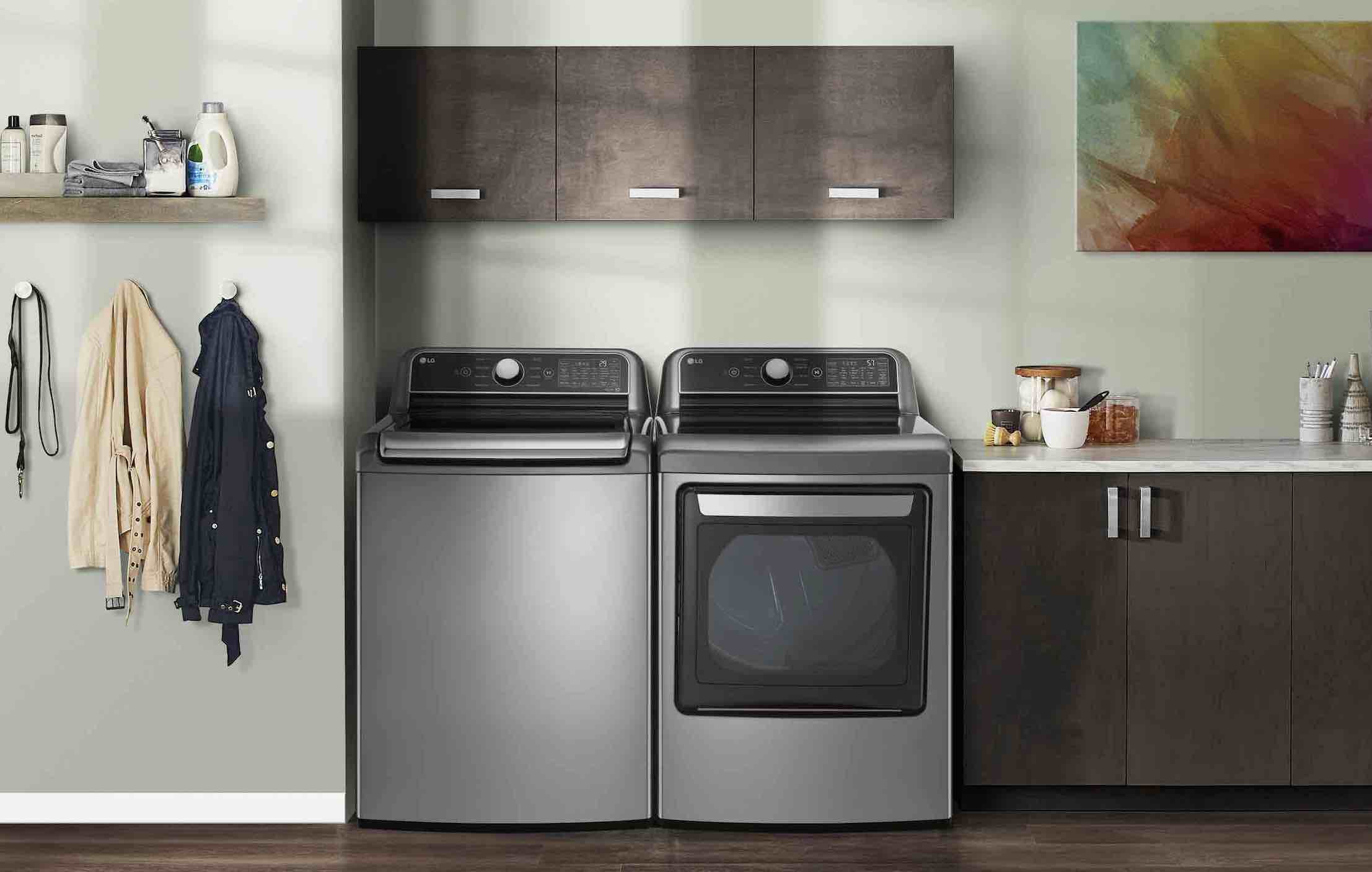 LG top load washer and dryer in gray in a laundry room